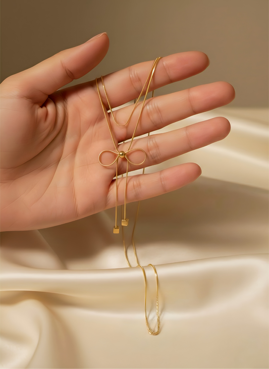 IMITATION GOLD BOW DOUBLE CHAIN PENDANT